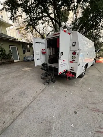 Magnet Plumbing service vehicle on-site for Grease Trap Cleaning in Holiday Beach